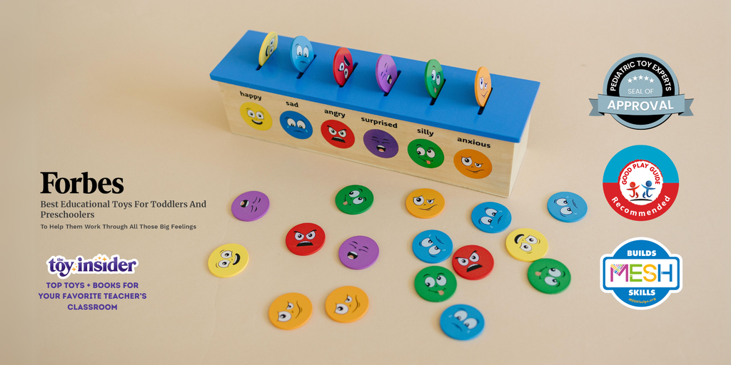 Montessori-inspired wooden box with blue top and emotion faces printed on the side. Includes wooden emotion coins matching the emotion faces on the box. 